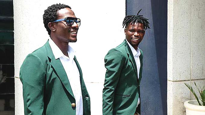 CHAMPIONS ON TOUR . . . FC Platinum’s Petros Mhari (left) and Ali Sadiki appear to be in a cheerful mood as they arrive at the Robert Gabriel Mugabe International Airport yesterday for their trip to Angola where they will plunge into the CAF Champions League this weekend