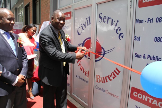 Minister Mandiwanira officially opening the Civil Service Travel Bureau. 