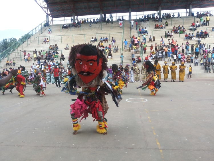 GOING BACK IN TIME ... A Gule dancer , nicknamed aSimoni , depicts the colonization of Africans by whites