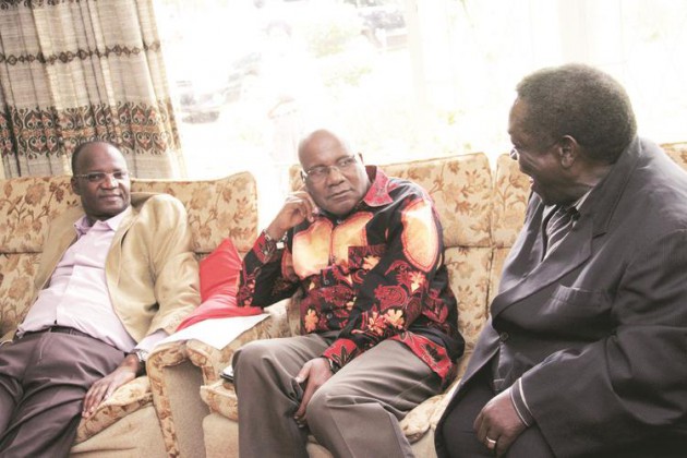 Information, Media and Broadcasting Services Minister Christopher Mushohwe flanked by his Higher and Tertiary Education, Science and Technology Development counterpart Professor Jonathan Moyo talks to former Mashonaland West governor Cde Peter Chanetsa at Cde Victoria Chitepo’s residence in Mt Pleasant, Harare, yesterday. — (Picture by Munyaradzi Chamalimba)