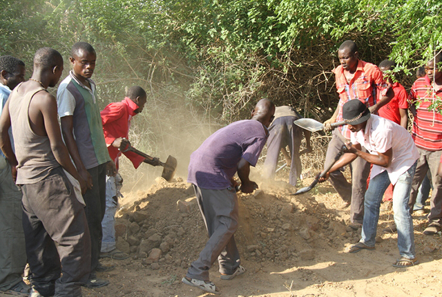 Villagers bury Owen Chianga's remains after he was killed by a crocodile while fishing in Save River. Inset: Liberty Ruzivo survived the crocodile attack after it mauled his leg. -  (Picture by Tinai Nyadzayo).