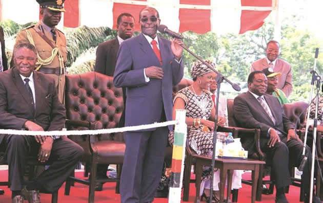 President Mugabe addresses zanu-pf supporters ahead of a crunch Politburo meeting on Wednesday at the revolutionary party’s headquarters while flanked by the First Lady Amai Grace Mugabe, who is also the Women’s League secretary, and his Vice Presidents Cdes Emmerson Mnangagwa and Phelekezela Mphoko (left)