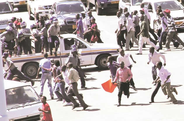 Police disperse MDC-T activists who staged an illegal demonstration to protest the alleged disappearance of Itai Dzamara outside Parliament building in Harare yesterday