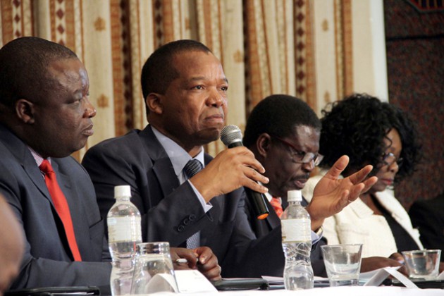 Reserve Bank of Zimbabwe Governor Dr John Mangudya (second left) addresses delegates while flanked by Industry and Commerce Minister Mike Bimba (second right), Bankers Association of Zimbabwe president Dr Charity Jinya (right) and ZNCC president Davison Norupiri and at the Zimbabwe National Chamber of Commerce breakfast meeting in Harare yesterday. — (Picture by Tawanda Mudimu)