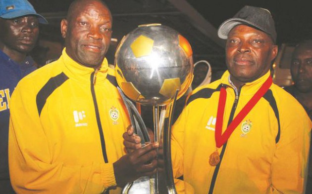 THE CUP IS OURS . . . Warriors coach Sunday Chidzambwa (right) and his assistant Lloyd Mutasa proudly display the Cosafa Castle Cup on arrival at Harare International Airport last night. —(Picture by Shelton Muchena)