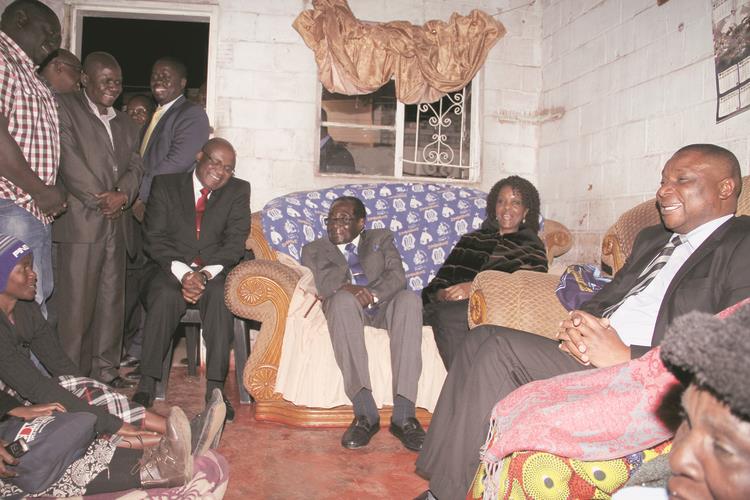 President Mugabe and First Lady Amai Grace Mugabe console the Mutaisi family following the death of Mrs Getrude Karigamombe-Mutaisi in Mbare, Harare, yesterday