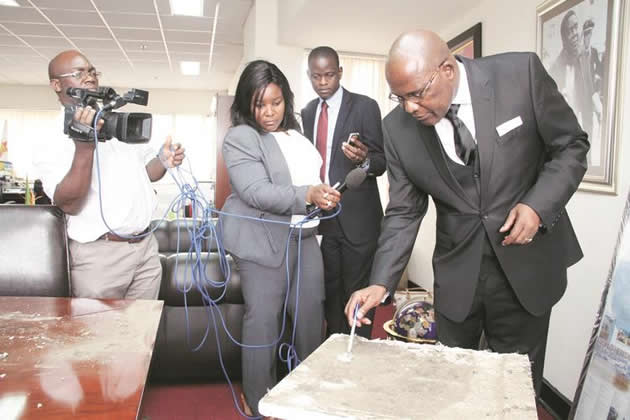 Information, Media and Broadcasting Services Minister Dr Christopher Mushohwe shows the media drill holes on the ceiling panel after a break-in at Acting President Emmerson Mnangagwa’s offices at the New Government Complex. — (Picture by Tawanda Mudimu)