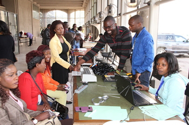 Delegates for the zanu-pf 6th Women’s League Conference being accredited at the revolutionary party’s headquarters in Harare yesterday.