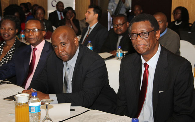Institute of Chartered Accountants of Zimbabwe chief executive Matts Kunaka (left), Insurance and Pension Commission head of Insurance and Micro Insurance Pupurai Togarepi (centre) and IPEC commissioner Tendai Karonga follow proceeding during a seminar jointly hosted by IPEC and ICAZ yesterday