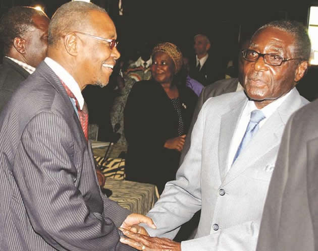 Dr Sikhanyiso Duke Ndlovu is greeted by President Mugabe ahead of an Ordinary Session of the zanu-pf Central Committee on September 18, 2008