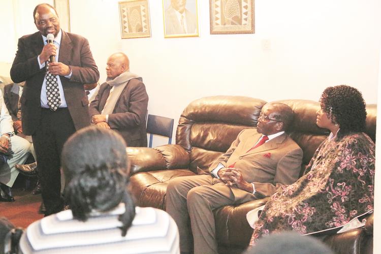 Foreign Affairs Minister Simbarashe Mumbengegwi addresses mourners, including President Mugabe and the First Lady Amai Grace Mugabe, who were paying condolences to the Mumbengegwi family yesterday following the death of former Finance Minister Dr Samuel Mumbengegwi