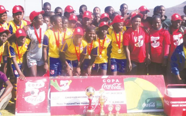 Chidyamakono High School pupils pose for a photo displaying their trophies after winning the Copa Coca Cola Girls Under-17 last year