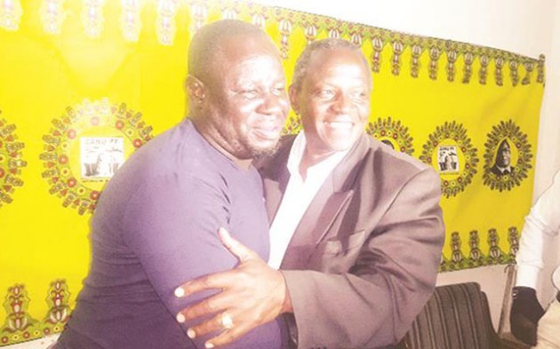 Chiwundura legislator Cde Brown Ndlovu (right) and Cde Pearson Mbalekwa embrace at a Press briefing in Gweru recently