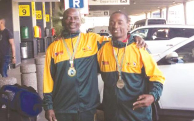 HISTORY MAKERS . . . Veteran Zimbabwean judoka Simon Mapanda (left) and his son Simba proudly display the gold and bronze medal they recently won at the South Africa Open Championships in Bloemfontein