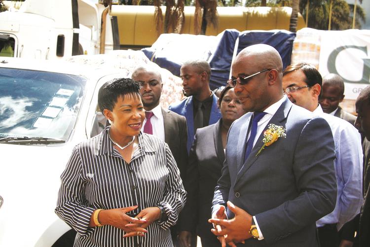 First Lady Auxillia Mnangagwa (left) speaks to Grain Millers Association of Zimbabwe chairman Tafadzwa Musarara after receiving an assortment of goods for orphanages and hospitals in Harare yesterday. — Picture by Justin Mutenda