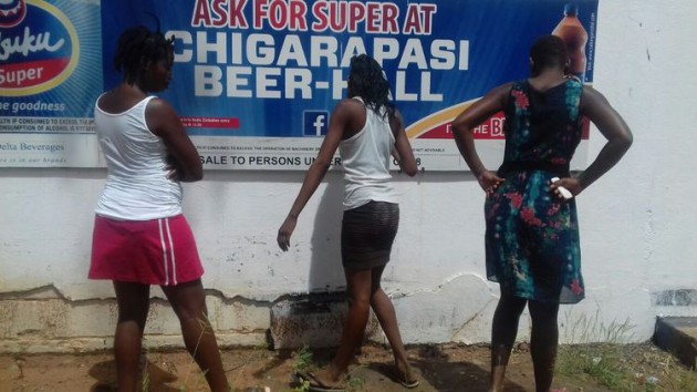 Women mill around the closed Chigarapasi Beerhall in Chiredzi recently