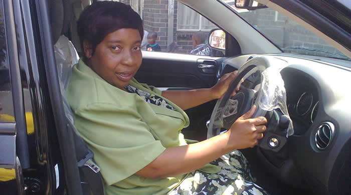 Mrs Nyasha Muparutsa gets a feel of the Jeep Compass she won during the TM Big Brands Bargain Bonanza promotion recently.
