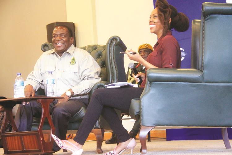 President Mnangagwa shares a lighter moment with moderator Vimbai Kajese during a youth interface programme hosted by Global Shapers Community Harare at Celebration Centre yesterday. — (Picture by Munyaradzi Chamalimba)