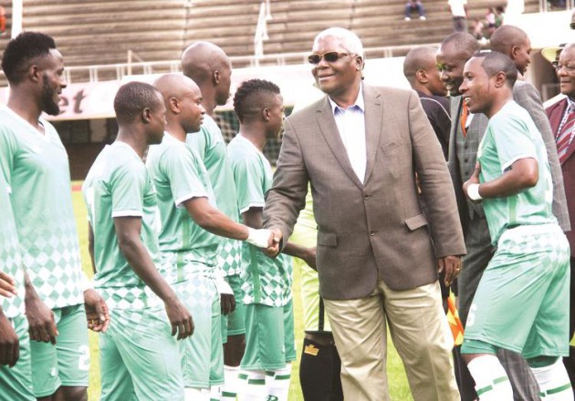 GUEST OF HONOUR . . . Home Affairs Minister Ignatius Chombo (in grey jacket) is being introduced to CAPS United midfielder Tafadzwa Rusike by the Green Machine’s captain Hardlife Zvirekwi before yesterday’s CAF Champions League match against Lioli of Lesotho at the National Sports Stadium