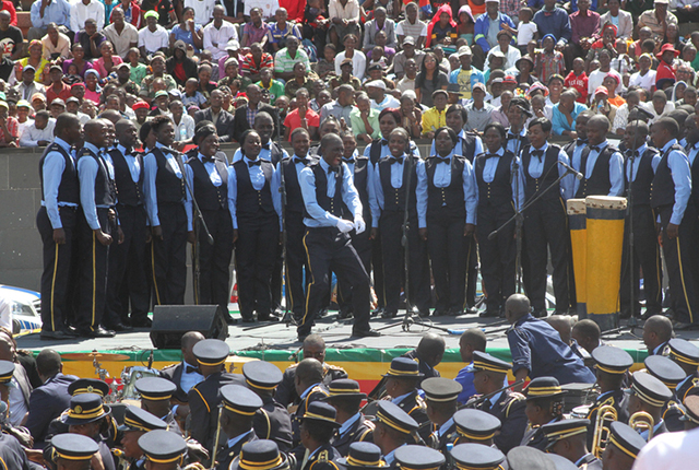Constable Phiri leads the ZRP choir during the recently held Heroes Day commemorations at the national shrine and (inset) wearing an infectious smile