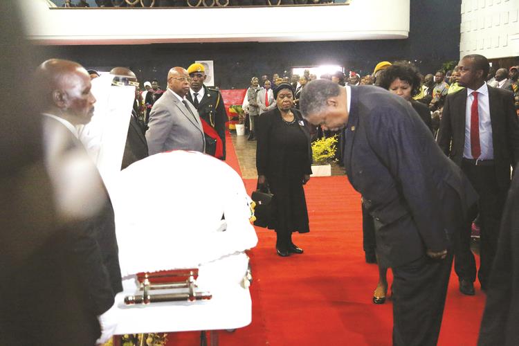Vice President Phelekezela Mphoko leads mourners in viewing the body of national heroine Senator Shuvai Ben Mahofa, who was Minister of State for Masvingo Provincial Affairs, at Stodart Hall in Mbare before burial at the National Heroes Acre yesterday. — (Picture by Believe Nyakudjara)