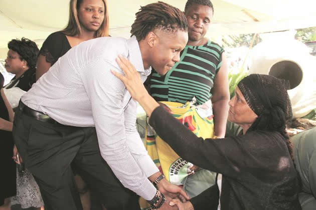 Robert Mugabe Junior consoles Mrs Jane Linda Georgias while Mavis Gumbo, Zanu-PF Harare Province, looks on at the Georgias home in Strathaven yesterday. - (Picture by Innocent Makawa)