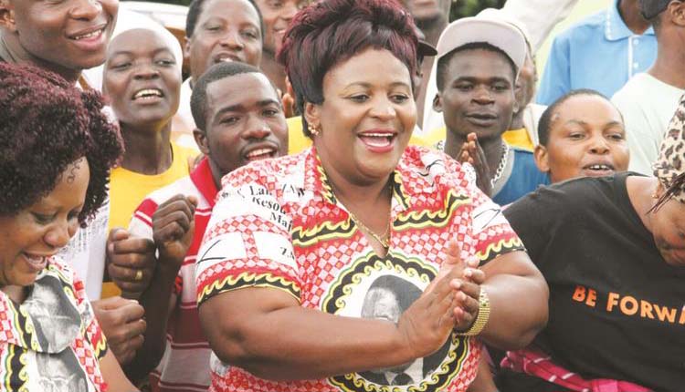 AND THE WINNER IS . . . Cde Beauty Chabaya celebrates with fellow zanu-pf supporters after her thumping win in which she polled 13 156 votes