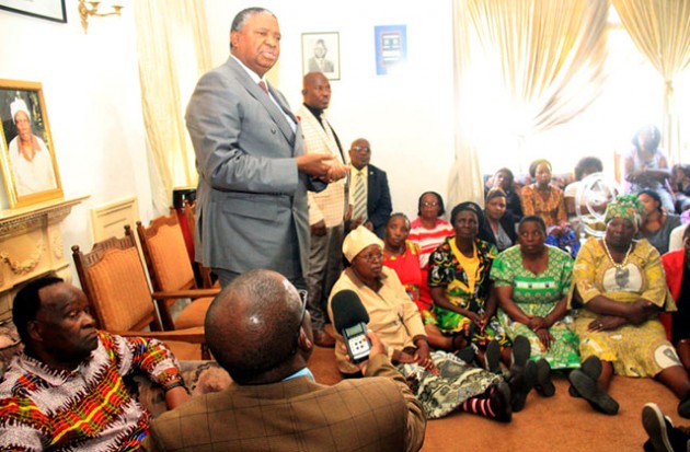 Vice President Phelekezela Mphoko addresses mourners at the Muzenda residence, while Minister of State for Liaising on Psychomotor Activities in Education Cde Josaya Hungwe looks on in Chisipite, Harare, yesterday. — (Picture by Munyaradzi Chamalimba)