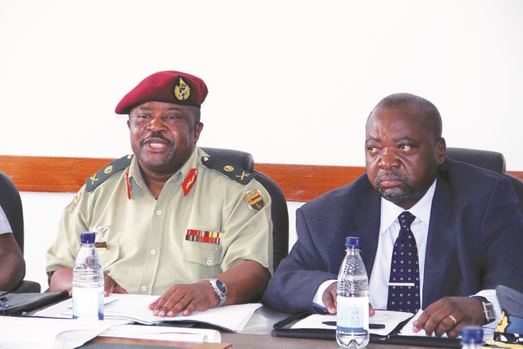 Major General Douglas Nyikayaramba expresses a point before the Parliamentary Portfolio Committee on Defence and Security yesterday. Looking on is Ministry of Defence Permanent Secretary Mr Martin Rushwaya. — (Picture by John Manzongo)