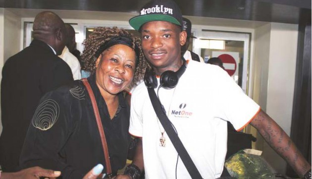 STAR ATTRACTION . . . Zimbabwe international forward Khama Billiat (right) is welcomed home by prominent music promoter Barbra Chikosi who was among people who converged at Harare International Airport to welcome the Warriors from their 2017 AFCON adventure in Gabon — (Picture by Paul Mundandi)