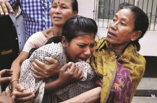 An Indian relative of activist Pranab Boro, who died after self-immolating during a protest, mourns in Guwahati yesterday. Boro, an activist from the Krisak Mukti Sangram Samiti self-immolated during a protest demanding land rights for local people in various regions of India’s eastern Assam state  and died after hospitalisation with burns covering over 90 percent of his body. Krishak Mukti Sangram Samiti, a peasant organisation based in Assam, works on a diverse range of issues, including corruption, land rights and employment. — AFP. 