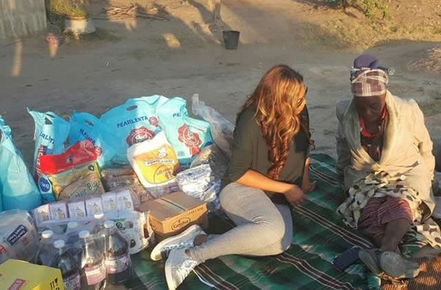 Mrs Mashangwa chats to a beneficiary after a donation of foodstuffs