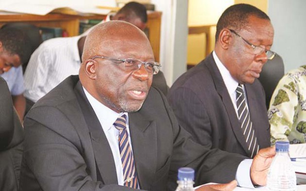 Foreign Affairs Secretary Ambassador Joey Bimha (left) stresses a point at Parliament Building yesterday. Following proceedings is acting Director of Finance and Administration in the ministry Mr Misheck Makuyana. — (Picture by John Manzongo)