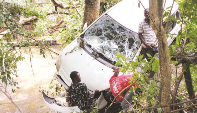 his vehicle was swept by floods for about 500 metres from its owner’s house, and was only stopped from plunging into a river by trees on the bank, after heavy rains pounded Carrick Estate in Borrowdale, Harare, yesterday. — (Picture by Innocent Makawa)