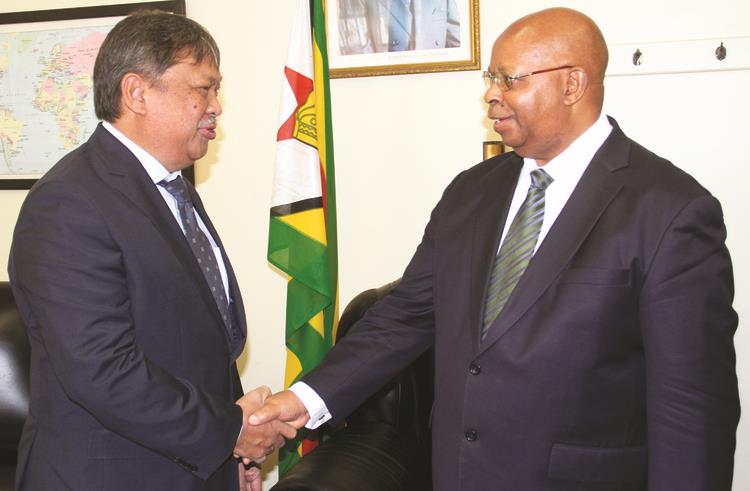 Speaker of the National Assembly Advocate Jacob Mudenda welcomes Indonesian Ambassador to Zimbabwe Mr Stephanus Yuwono in Harare yesterday. — (Picture by John Manzongo)