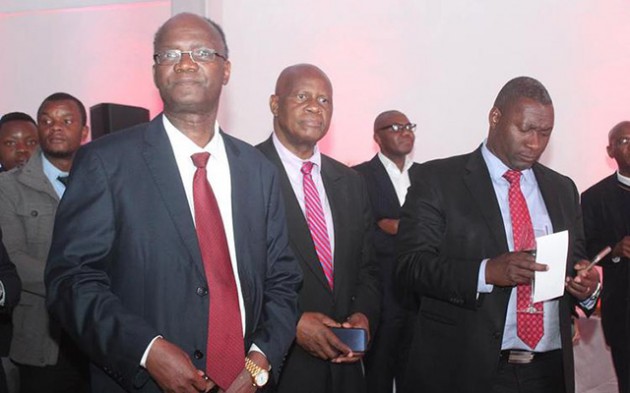 Higher and Tertiary Education, Science and Technology Minister Professor Jonathan Moyo (left), Finance and Economic Development Minister Patrick Chinamasa (middle) and Information, Communication Technology, Postal and Courier Services Minister Supa Mandiwanzira  follow proceedings during the launch of Brainworks Capital’s newly branded  mobile payment platform, GetCash on Tuesday