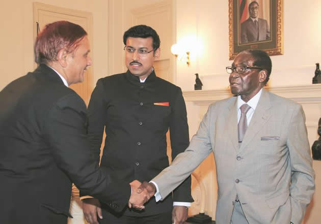 President Mugabe welcomes Acting Indian Ambassador to Zimbabwe MR Rakshpaul Malhotra while Indian Minister of State for Information and Broadcasting Colonel Rajyavardhan Rathore (centre) looks on at State House in Harare yesterday. - Picture by Tawanda Mudimu