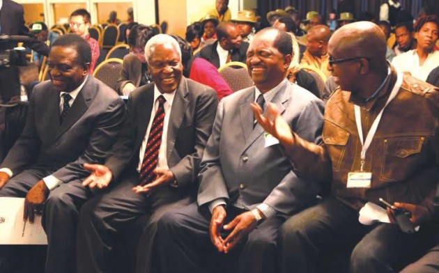 Obert Gutu, MDC-T presidential candidate`s chief election agent (extreme right),sharing a llighter momen with senior Zanu PF members Cdes. Rugare Gumbo; Sydney Sekeramayi and Emerson Mnangagwa just before the announcement of the presidential results on August 3 at the Harare International Conference Centre
