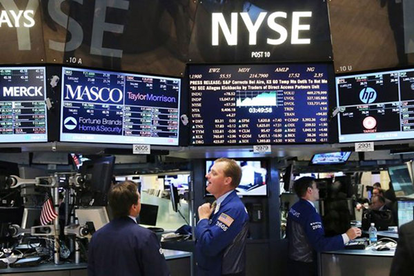 Traders at the New York Stock Exchange. - Reuters