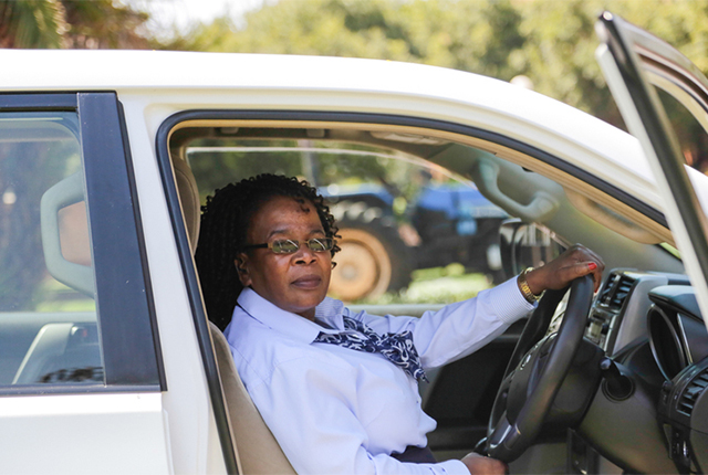 Ms Aggipher Rukawo in one of the vehicles at her workplace