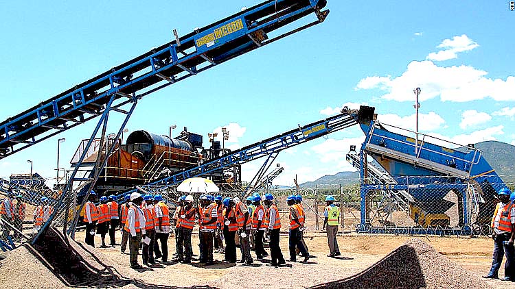 Diamond experts inspect equipment at a mine in Chiadzwa