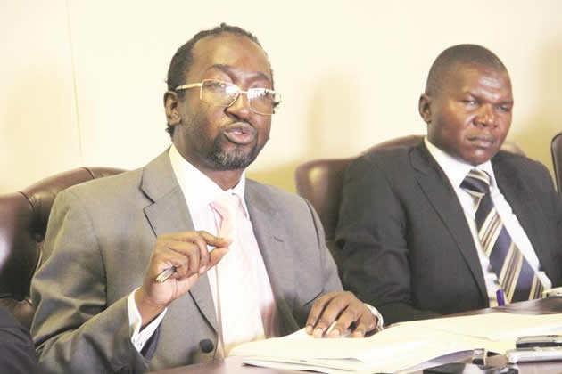 Youth Development, Indigenisation and Economic Empowerment Minister Patrick Zhuwao stresses a point during a meeting with graduates of the National Youth Service while his deputy, Mathias Tongofa, follows proceedings. — Picture by Munyaradzi Chamalimba