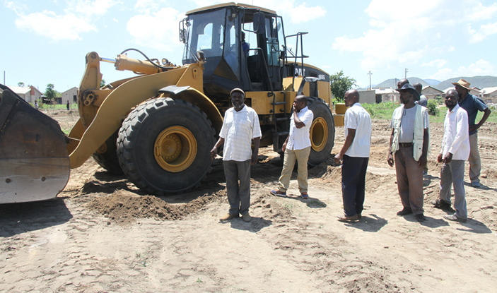 Members of the Johanne Masowe Gospel of God Church International monitor work in progress at the new school in Hobhouse recently