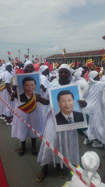Members of the apostolic sects hold pictures of President Xi