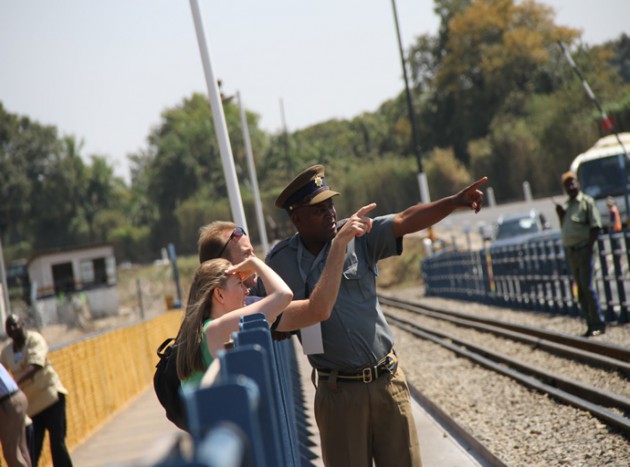 A Police officer gives tourists directions