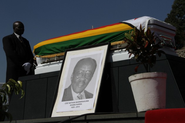 A pallbearer stands by the late Cde Shamuyarira's casket Picture by Kudakwashe Hunda)
