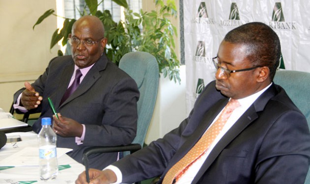 Agribank chief executive Sam Malaba (left) stresses a point during a press conference yesterday while finance director Mr Elfas Chimbera pays attention. —  (Picture by Tariro Kamangira)