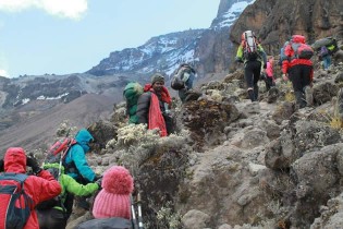 ALMOST THERE . . . The six climbers make the final ascend to Uhuru Peak