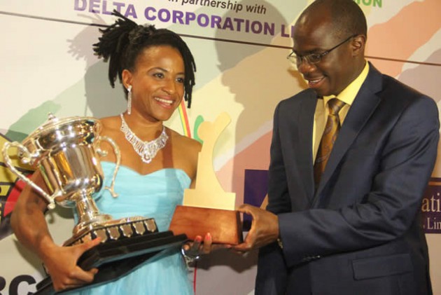Winners’ PODIUM . . . Sport and Recreation Minister Makhosini Hlongwane (right) hands over the Sportsperson of the Year Award to Helen Sinclair Costa