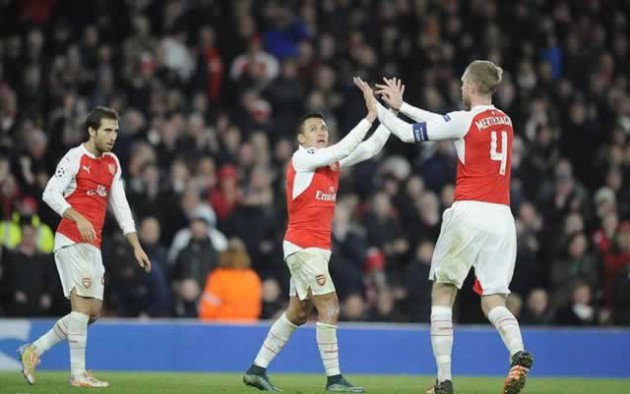 HIGH FIVE . . . Arsenal players (from left) Mathieu Flamini, Alexis Sanchez and Per Mertesacker celebrate the third goal as the Gunners finished the evening in style against Zagreb at the Emirates on Tuesday. — Mailonline